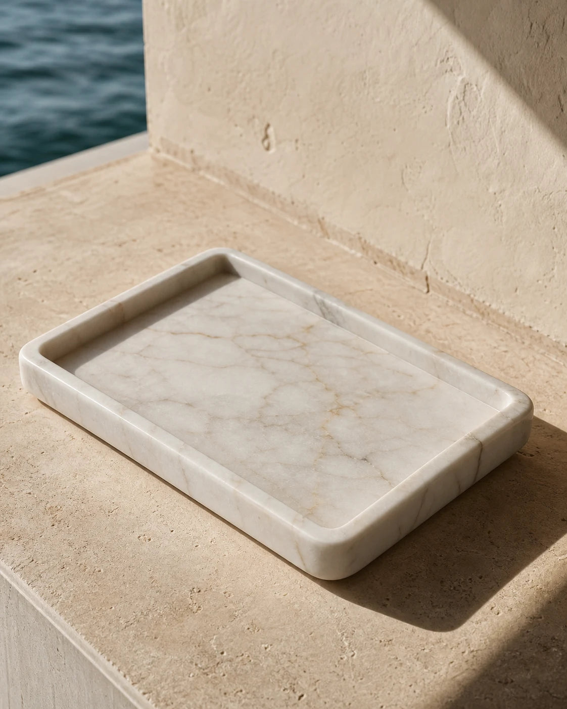 A pale marble catchall tray selected for The Luxe Edit